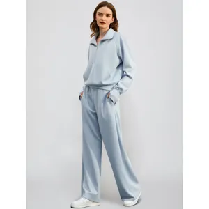 Light blue women's half zip sweatshirt and wide leg sweatpants two piece casual tracksuit set.