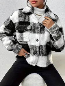 Black and white plaid fleece shacket detail view, cozy sherpa jacket texture and button design.