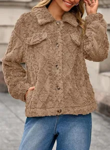 Detail shot showing the soft fleece texture and button closure of the warm brown cardigan coat.