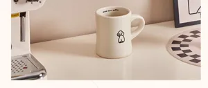Ceramic coffee mug with cute dog pattern and inner rim text design for daily home and office.