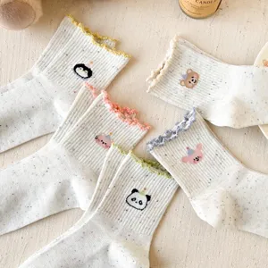Detail shot of cute cartoon women socks with lettuce edge and breathable speckled mesh yarn.