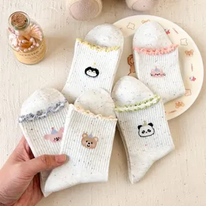 Cute cartoon animal dotted yarn ruffle mid-tube women socks detail view for daily wear.