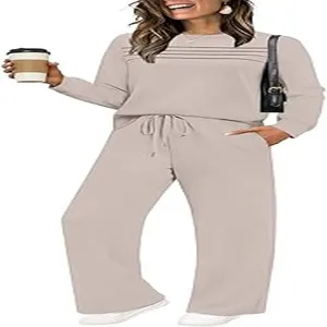 Casual two-piece lounge set featuring a long sleeve top and wide leg pants in beige.