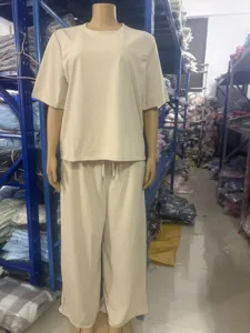 Detailed view of the casual solid color short sleeve top and wide leg pants clothing set.