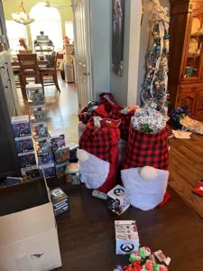 Red and black plaid Christmas gnome gift bag large capacity holiday decor storage bag.