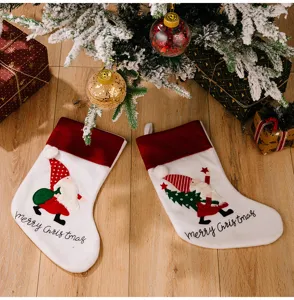 Christmas stockings set with cute gnome Santa embroidery, perfect holiday decor.