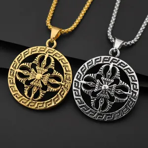Detailed view of vintage alloy pendant necklace, intricate geometric totem and metal chain.