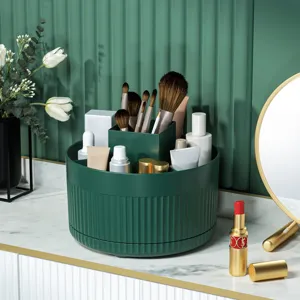 Rotating makeup organizer and brush holder for desktop vanity, green plastic storage box.