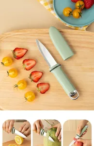 Detailed view of the green fruit knife with protective sheath on cutting board with fresh fruits.