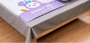 Detailed view of a vacuum compression storage bag with cute rabbit print for quilts and clothes.