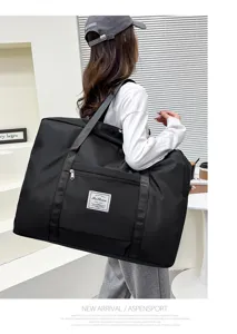 Detailed view of large capacity waterproof travel duffel bag carried by model, showing size.