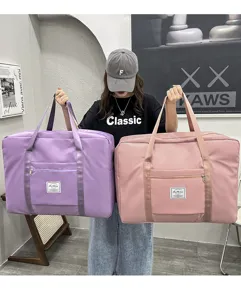 Large capacity waterproof travel bag, portable quilt storage bag for moving and home organization.