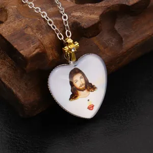 Vintage heart cross pendant necklace with religious portrait and rhinestones for daily wear.