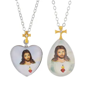 Exquisite religious Jesus cross crystal pendant necklaces, featuring heart and teardrop shapes.