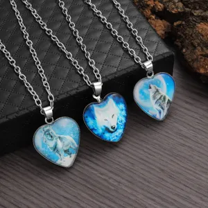Wolf totem heart crystal pendant necklace detail view, showcasing intricate design and fine chain.