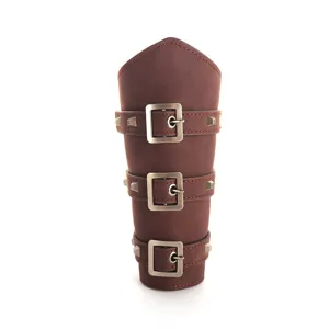 Detailed view of medieval punk leather bracer, triple buckle strap and rivet design.