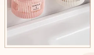 Wall-mounted plastic storage basket, hanging organizer for kitchen and bathroom, detail view.
