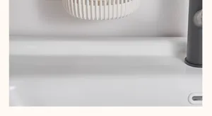 Wall mounted hanging storage basket detail view for kitchen and bathroom small item organizer.