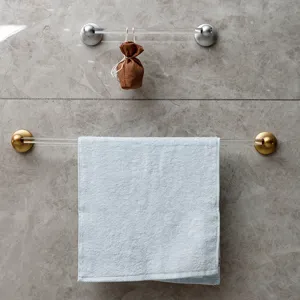 Luxury clear acrylic towel bar with metal base for modern bathroom wall mount storage.