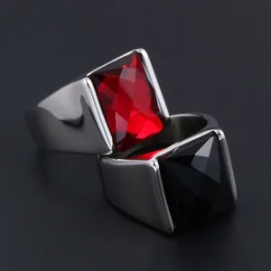 Detailed closeup of men vintage alloy rings with red and black faceted square stones.