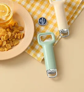 Detailed view of kitchen bottle opener in warm scene with snacks and drinks setup.