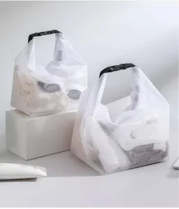White mesh cosmetic storage bag detail, minimalist waterproof travel pouch for outdoor fitness.