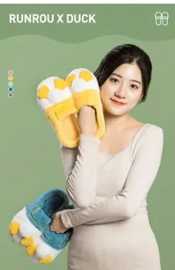 Detailed view of cozy cartoon duck plush cotton slippers showing soft material and warm design.