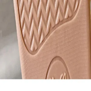 Detailed close-up shot of anti-slip textured sole for comfortable home cotton slippers.