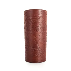 Embossed leather bracer detail showing medieval wolf pattern and texture craftsmanship.