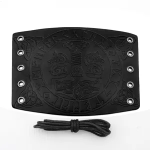Detail view of medieval punk leather wrist bracer with embossed runic symbols and metal eyelets.