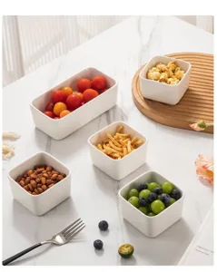 White ceramic square bowls set for snacks, dipping sauces, and desserts. Perfect home tableware.