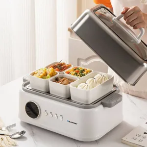 Electric food steamer with ceramic bowls for healthy cooking, compact kitchen appliance.