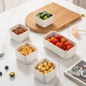 Ceramic square bowl for snacks, dipping sauce, and steaming. White home kitchen tableware set.