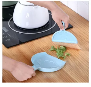 Desktop cleaning mini broom and dustpan set shown in daily use scene for easy debris removal.