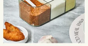 Clear multi-compartment seasoning box detail, transparent kitchen spice container storage.