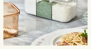 Multi-compartment clear kitchen seasoning box set with lids, ideal for home spice storage.