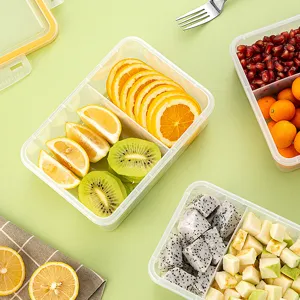Clear plastic partitioned fruit container portable bento lunch box with fresh fruit slices