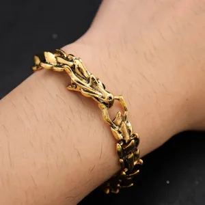Vintage dragon bone chain bracelet for men, punk hip-hop gold metal jewelry wrist accessory.