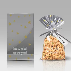 Transparent baking packaging bag with star pattern, ribbon and gift tag for cookies.
