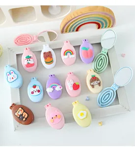 Cute cartoon foldable hairbrush with compact mirror, portable mini macaron massage comb for travel.