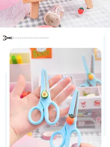 Cute cartoon student safety scissors detail, avocado and orange fruit decor handle.
