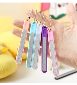 Detailed view of colorful nail files set with ball chains, perfect for daily manicure care.