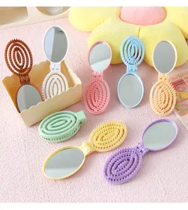 Brosse à cheveux pliante macaron avec miroir, peigne de massage portable pour femme.