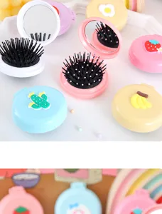 Brosse pliable compacte avec miroir, design de fruits mignon, idéale pour le sac à main.