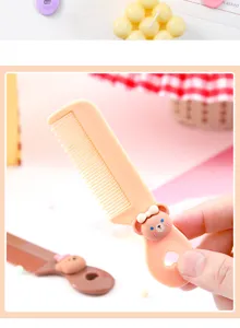 Close up of cute cartoon bear children hair comb, mini portable hair styling tool detail view.
