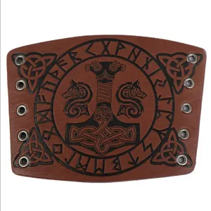 Detailed view of medieval Viking Thor's hammer embossed brown leather bracer COS accessory.