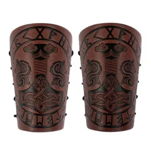 Detailed view of medieval Viking Thor hammer embossed leather bracers with runes.