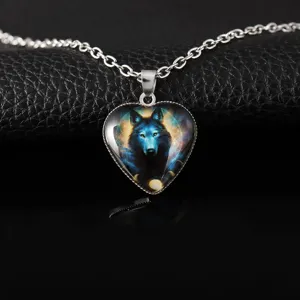 Close-up detail view of the heart-shaped wolf totem pendant necklace with fine silver chain.