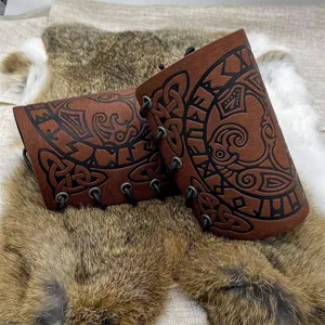 Viking medieval leather bracers with Norse raven and rune embossing for cosplay accessories.