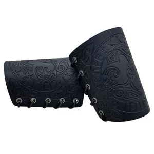Close-up of black leather bracers with Nordic rune embossing and lace-up design.